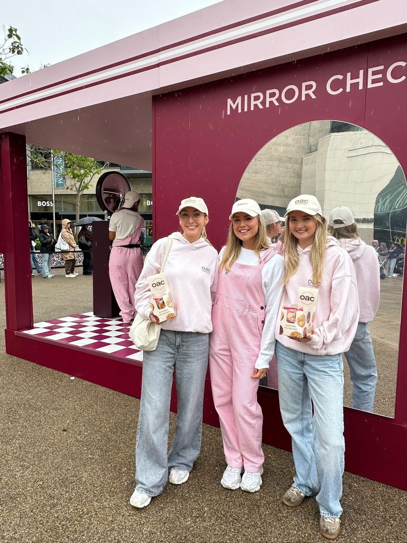 oac team at the Sculpted by Aimee Mirror Check stand